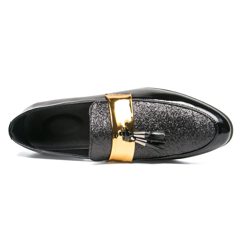 men's leather tassel shoes in black with a glittery upper and a gold accent detail.