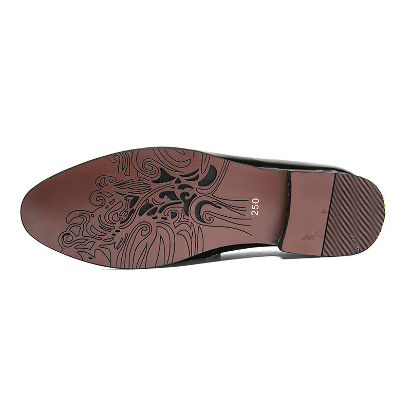 bottom view of men's leather tassel shoes showcasing intricate sole design and rubber sole material.